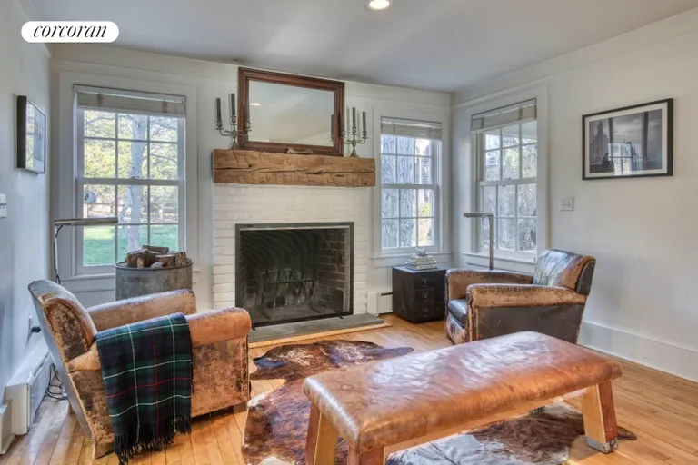 New York City Real Estate | View 56 West Neck Road | sitting room with fireplace | View 5