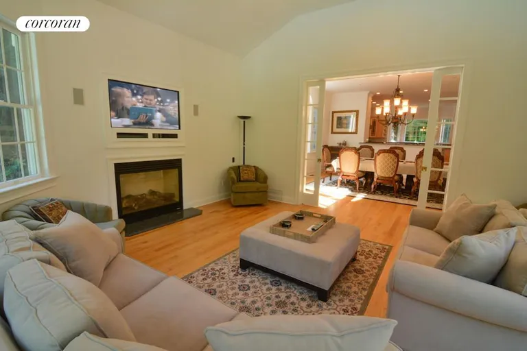 New York City Real Estate | View 11 Eastwood Court | den with fireplace | View 7