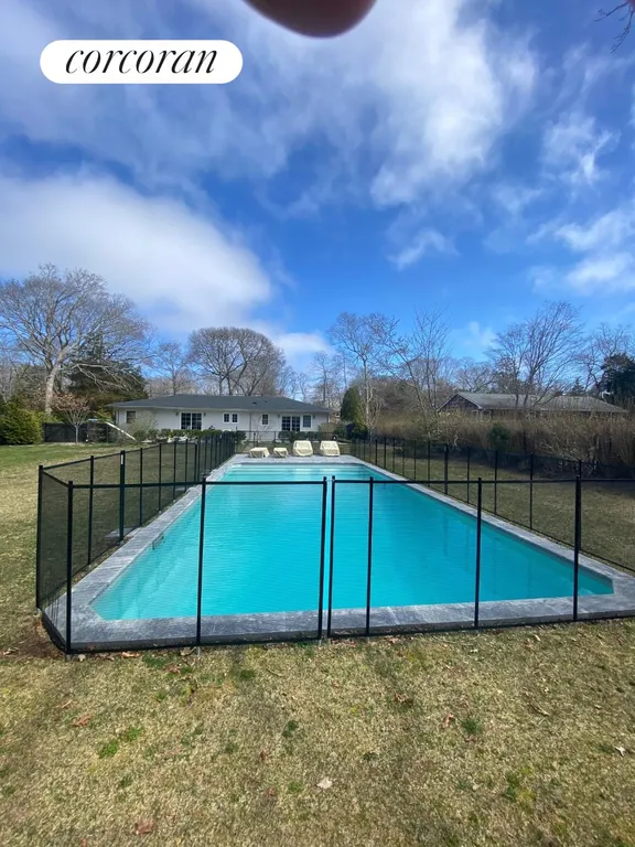New York City Real Estate | View 22 Sandra Road | Child barrier fence right around the poo | View 21