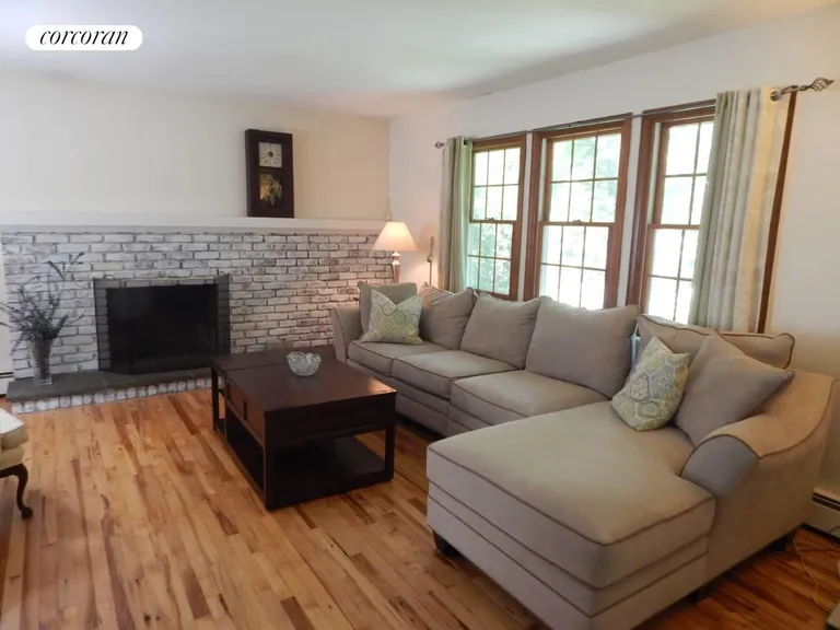 New York City Real Estate | View 85 Jagger Lane | Living with fireplace | View 2