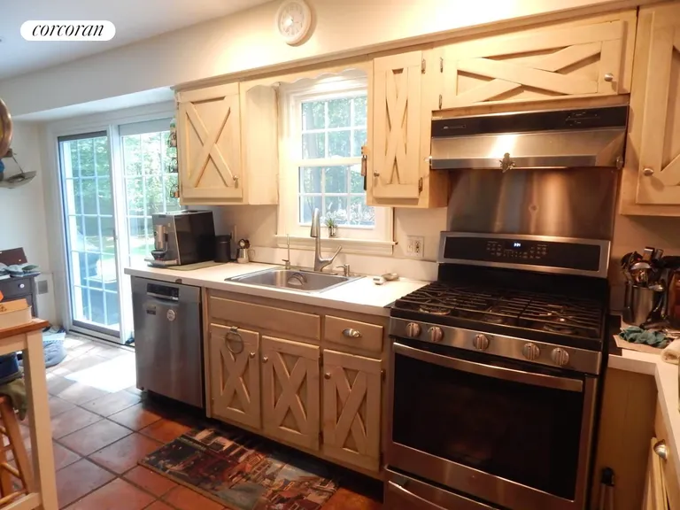 New York City Real Estate | View 85 Jagger Lane | Kitchen with sliders to deck | View 5