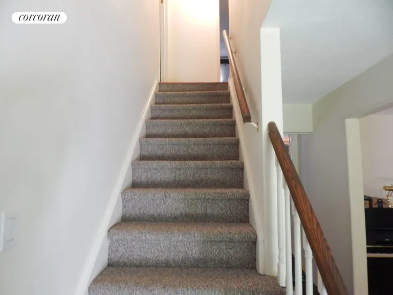 New York City Real Estate | View 85 Jagger Lane | Stairs to upper level | View 8