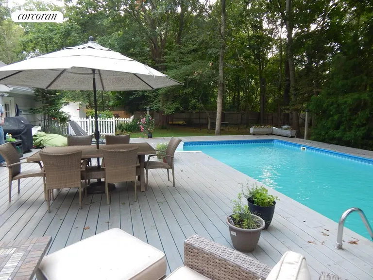 New York City Real Estate | View 85 Jagger Lane | Spacious Deck with Heated pool | View 11