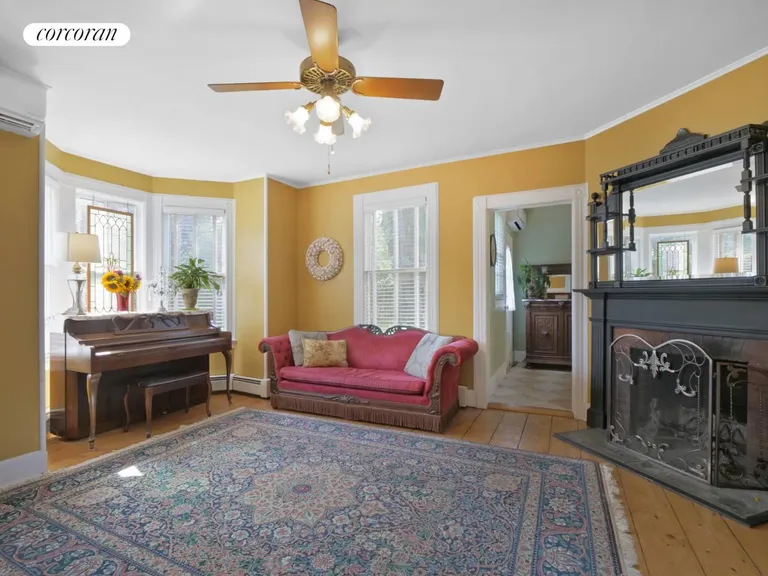 New York City Real Estate | View 20 Bay Avenue | Parlor with fireplace | View 6