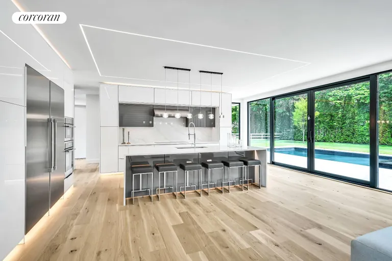 New York City Real Estate | View 390 Edge of Woods Road | Large Center Island | View 14