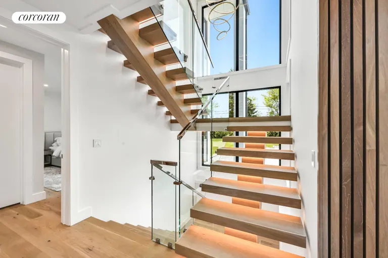 New York City Real Estate | View 390 Edge of Woods Road | Floating Stairs | View 25