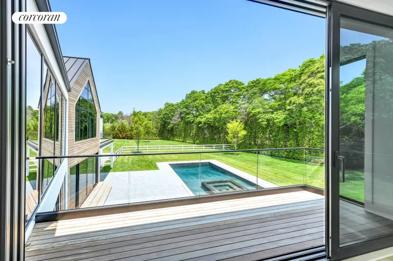 New York City Real Estate | View 390 Edge of Woods Road | Upstairs Primary Deck View | View 28