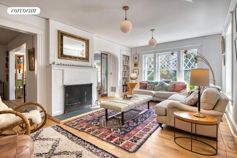 New York City Real Estate | View 151 North Ferry Road | Living room with fireplace | View 9