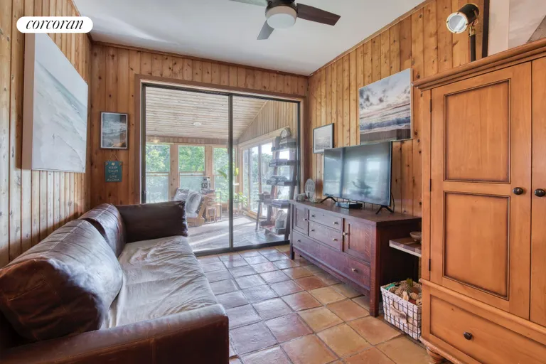 New York City Real Estate | View 7 Gazon Road | Dining area opening to enclosed porch | View 12
