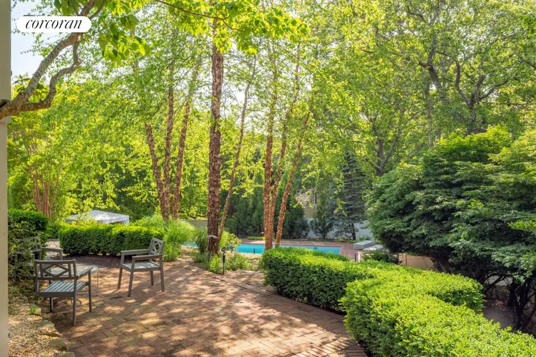 New York City Real Estate | View 14 Farragut Road | mid level patio in the garden | View 2