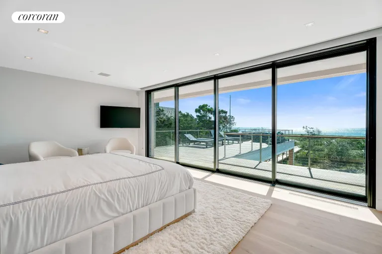 New York City Real Estate | View 345 Dune Road | Primary Suite with Ocean-side Deck | View 17