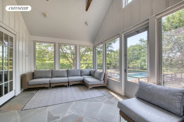 New York City Real Estate | View 119 & 121 South Midway Road | poolside screened porch | View 14