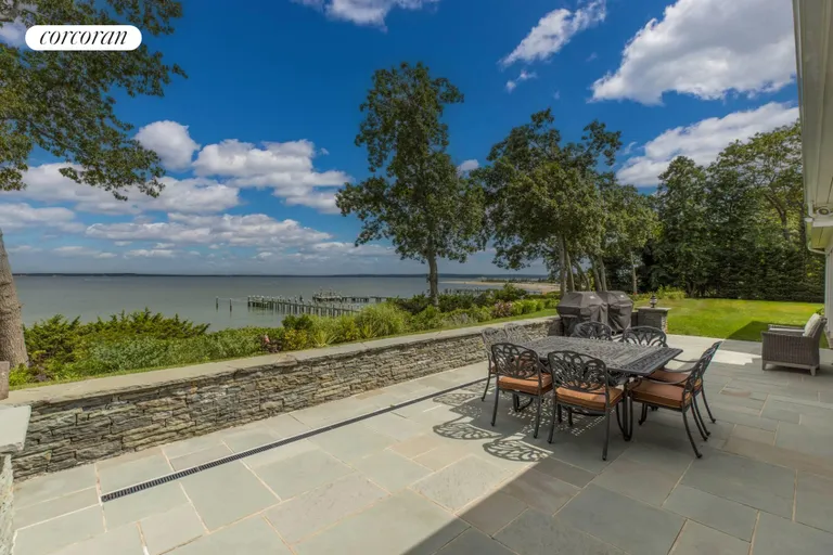New York City Real Estate | View 750 Paradise Point Road | rear stone Patio | View 9