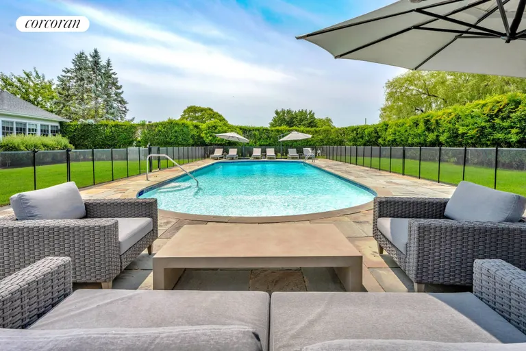 New York City Real Estate | View 245 Oneck Lane | Lounge Area Beside Pool | View 34