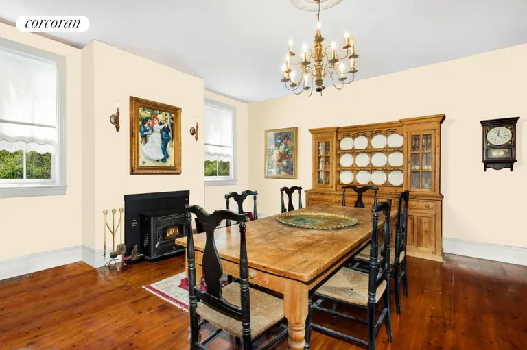New York City Real Estate | View 13555 New Suffolk Avenue | Dining Room with Fireplace | View 15
