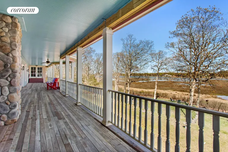 New York City Real Estate | View 13555 New Suffolk Avenue | Covered Porch with Fireplace | View 28