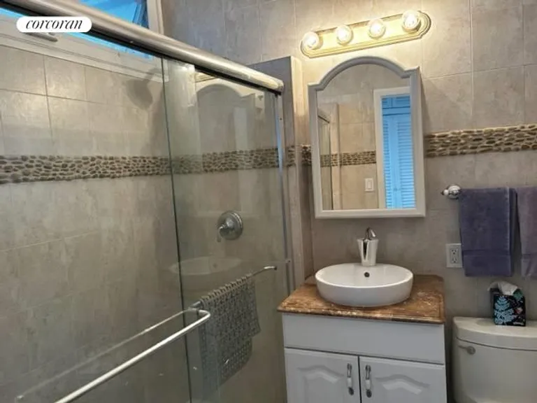 New York City Real Estate | View 101 Dune Road, Unit B14 | Updated Bath with Stall Shower | View 6