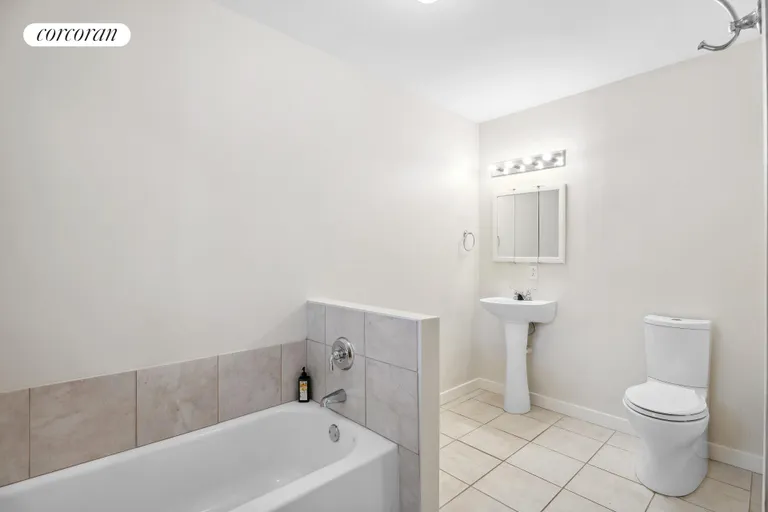 New York City Real Estate | View 4 Underwood Drive | Second floor bathroom (shower and tub) | View 8