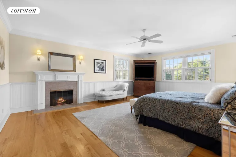 New York City Real Estate | View 15 Bridle Path | Primary Bedroom(virtually enhanced fire) | View 17