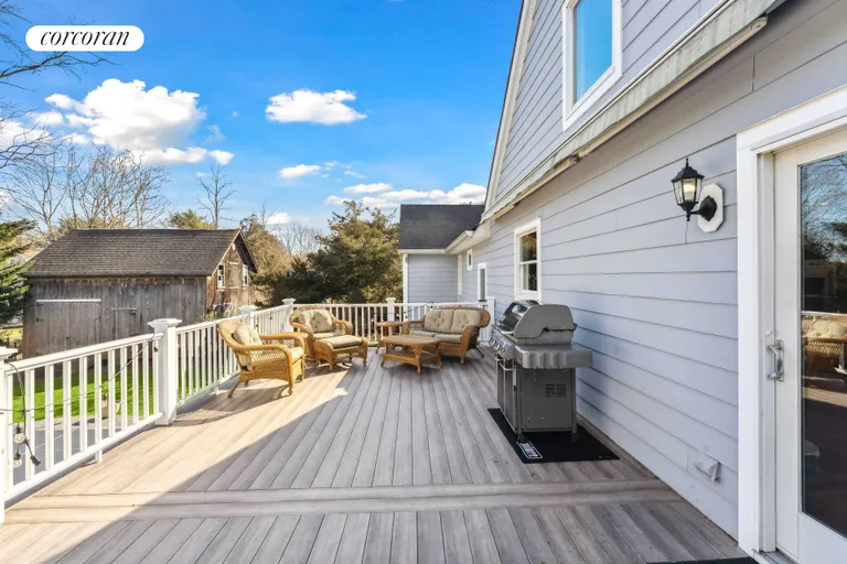 New York City Real Estate | View 64 Tanners Neck Lane | Deck Overlooking Pool | View 17