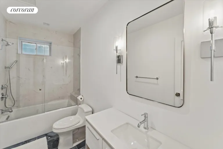 New York City Real Estate | View 43 Newtown Road | Lover Level Guest Bathroom | View 23