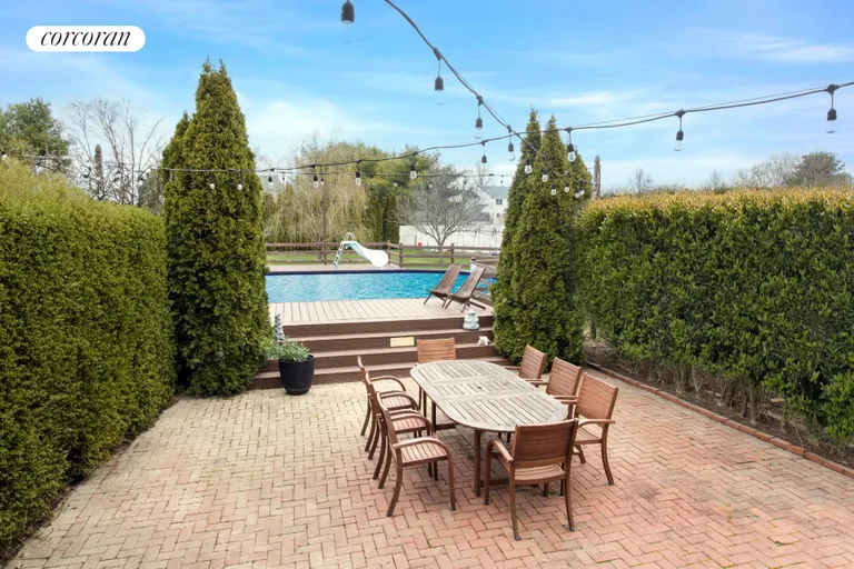 New York City Real Estate | View 80 May Drive | Privacy hedges & sunny patio/decking | View 13