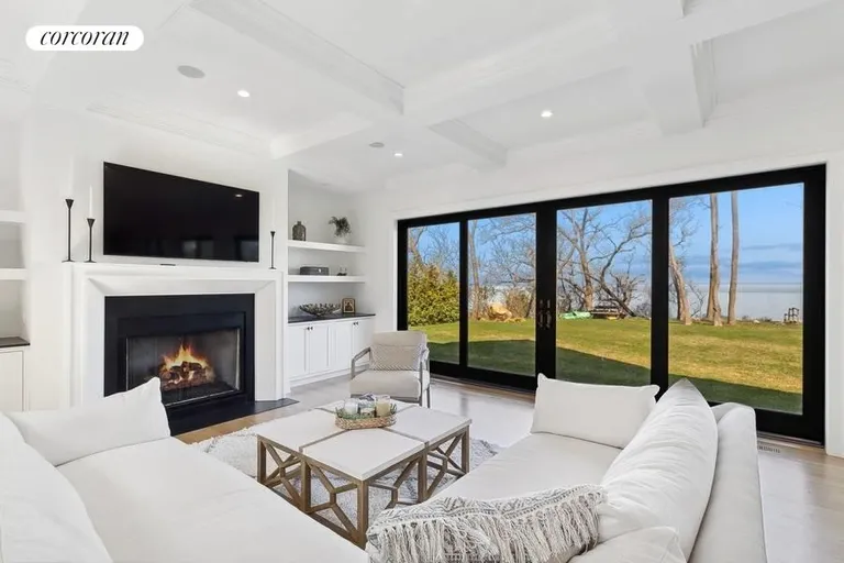 New York City Real Estate | View 17877 Soundview Avenue | Living Room with Fireplace | View 5
