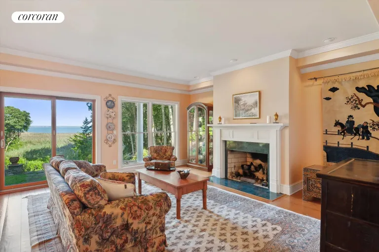 New York City Real Estate | View 156 Ram Island Drive | Living Room With Gas Fireplace | View 8