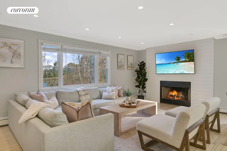 The Hamptons Real Estate | View 36 Charla Drive | Living Room with Fireplace | View 3
