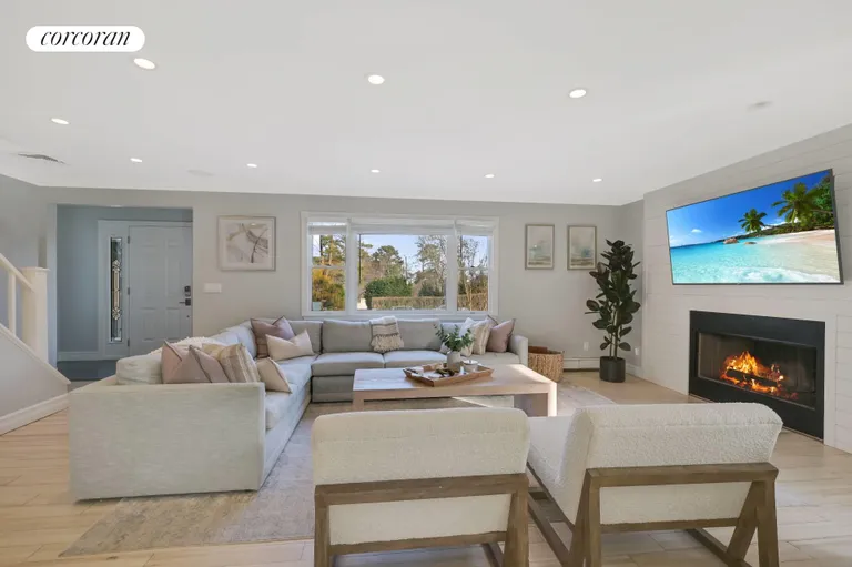 The Hamptons Real Estate | View 36 Charla Drive | Living Room with Fireplace | View 5