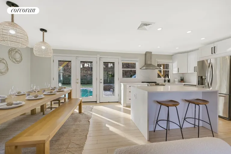 The Hamptons Real Estate | View 36 Charla Drive | Dining & Kitchen Opens to Backyard | View 9