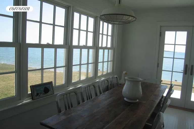 New York City Real Estate | View 80 Peconic Avenue | dining room with doors to porch | View 6