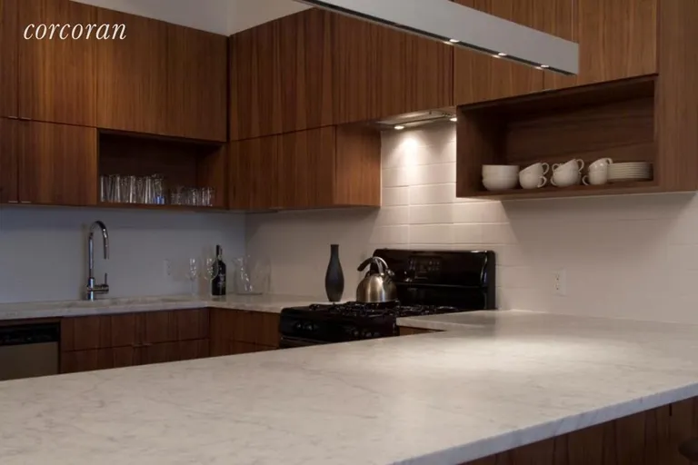 New York City Real Estate | View 50 BRIDGE STREET, 412 | Marble Counter Top and Walnut Cabinetry | View 2
