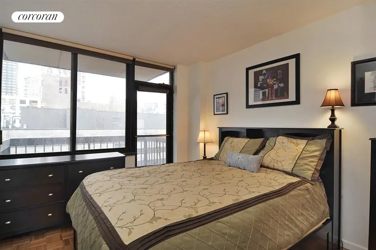 New York City Real Estate | View 403 East 62Nd Street, 8D | Master bedroom with private balcony | View 3