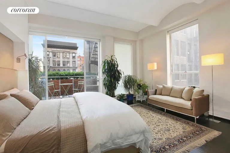 New York City Real Estate | View 24 East 22nd Street, 6 FL | Spacious Master Bedroom Suite with planted balcony | View 7