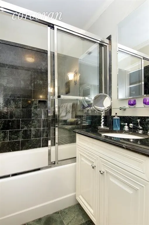 New York City Real Estate | View 22 West 66th Street, 2A | Large guest bath with glass enclosed shower & tub | View 9