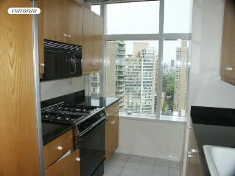 New York City Real Estate | View 160 West 66th Street, 30D | Windowed kitchen with Central Park views | View 5