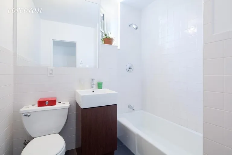 New York City Real Estate | View 92 Horatio Street, 3N | Windowed bathroom with sparkling white tiles | View 3