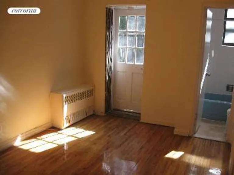 New York City Real Estate | View 330 East 90th Street, 1A | Bedroom/Bathroom/Door to Garden | View 4