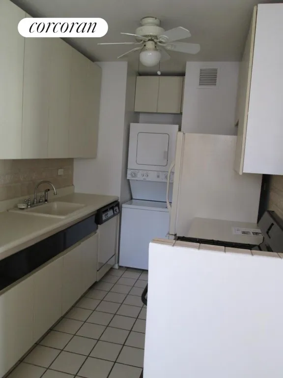 New York City Real Estate | View 343 East 74th Street, 10C | Kitchen with washer & dryer, dishwasher, new range | View 9