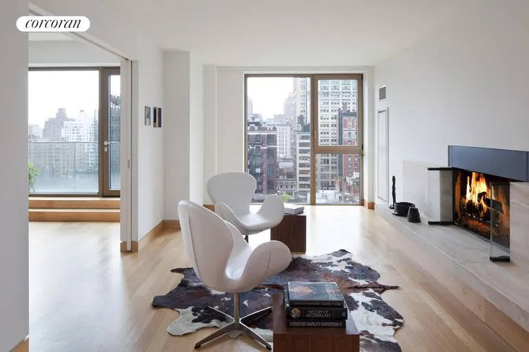 New York City Real Estate | View 50 Gramercy Park North, PH | Wood burning fireplace in library. | View 5