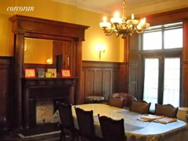 New York City Real Estate | View 127 West 119th Street, 1 | Dining room/ FP/ doors to deck | View 12