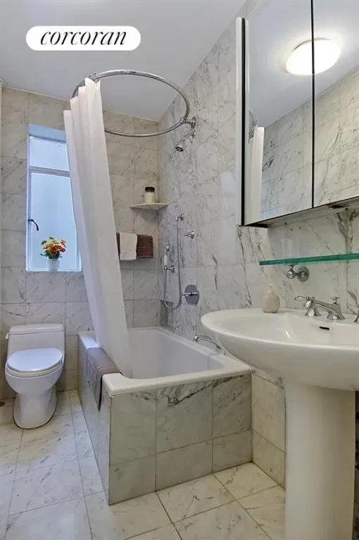 New York City Real Estate | View 255 West 23rd Street, 2CW | Renovated marble windowed bath | View 5