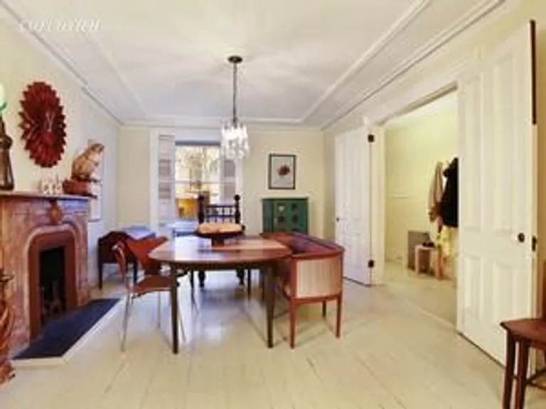 New York City Real Estate | View 30 Strong Place | Garden-level dining room with fireplace | View 4