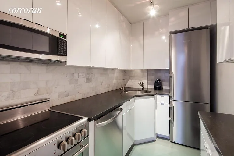 New York City Real Estate | View 23 East 10th Street, 415 | Fully renovated kitchen opens into living room | View 2