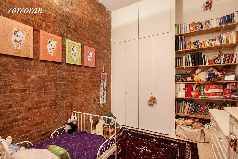New York City Real Estate | View 23 East 10th Street, 415 | 2nd BR has great storage and custom bookshelves | View 4