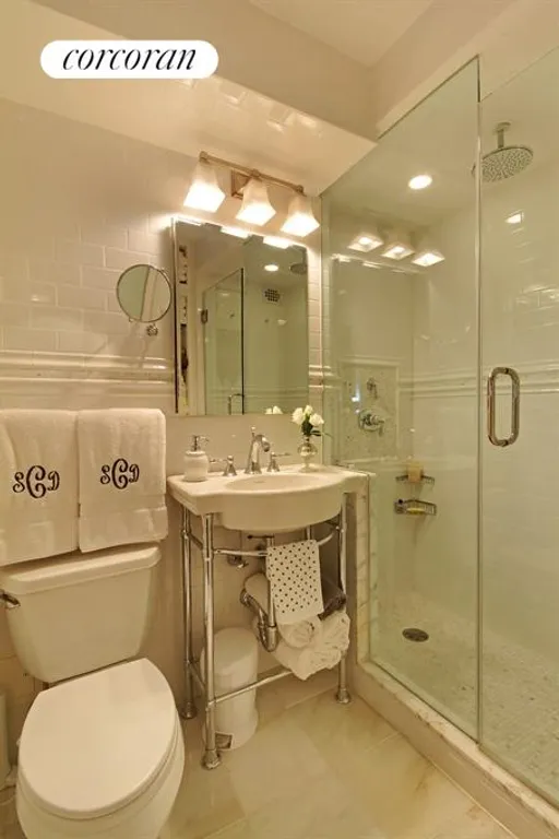 New York City Real Estate | View 150 East 61st Street, 4F | Bathroom and Powder Room completely redone | View 4