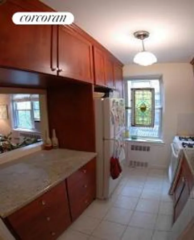 New York City Real Estate | View 220 Congress Street, 2D | Renovated Kitchen with Window and Pass-Through | View 4