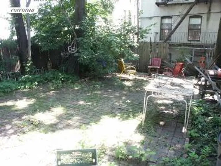New York City Real Estate | View 758 Beck Street | Backyard with shade tree | View 6