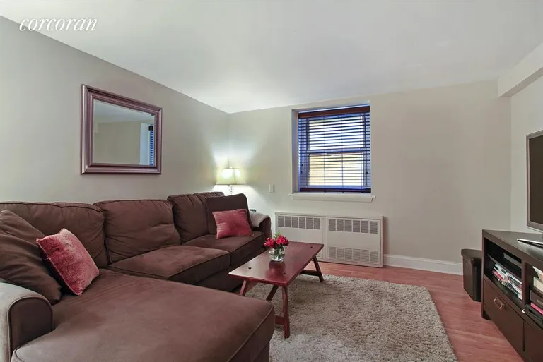 New York City Real Estate | View 211 Thompson Street, GLK | Sunken living room. | View 2